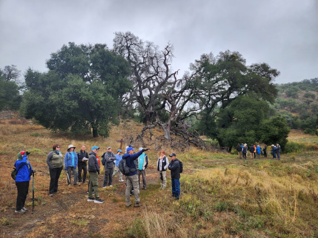 A group of hikers receive direction on the trail in Eagle Peak Ranch