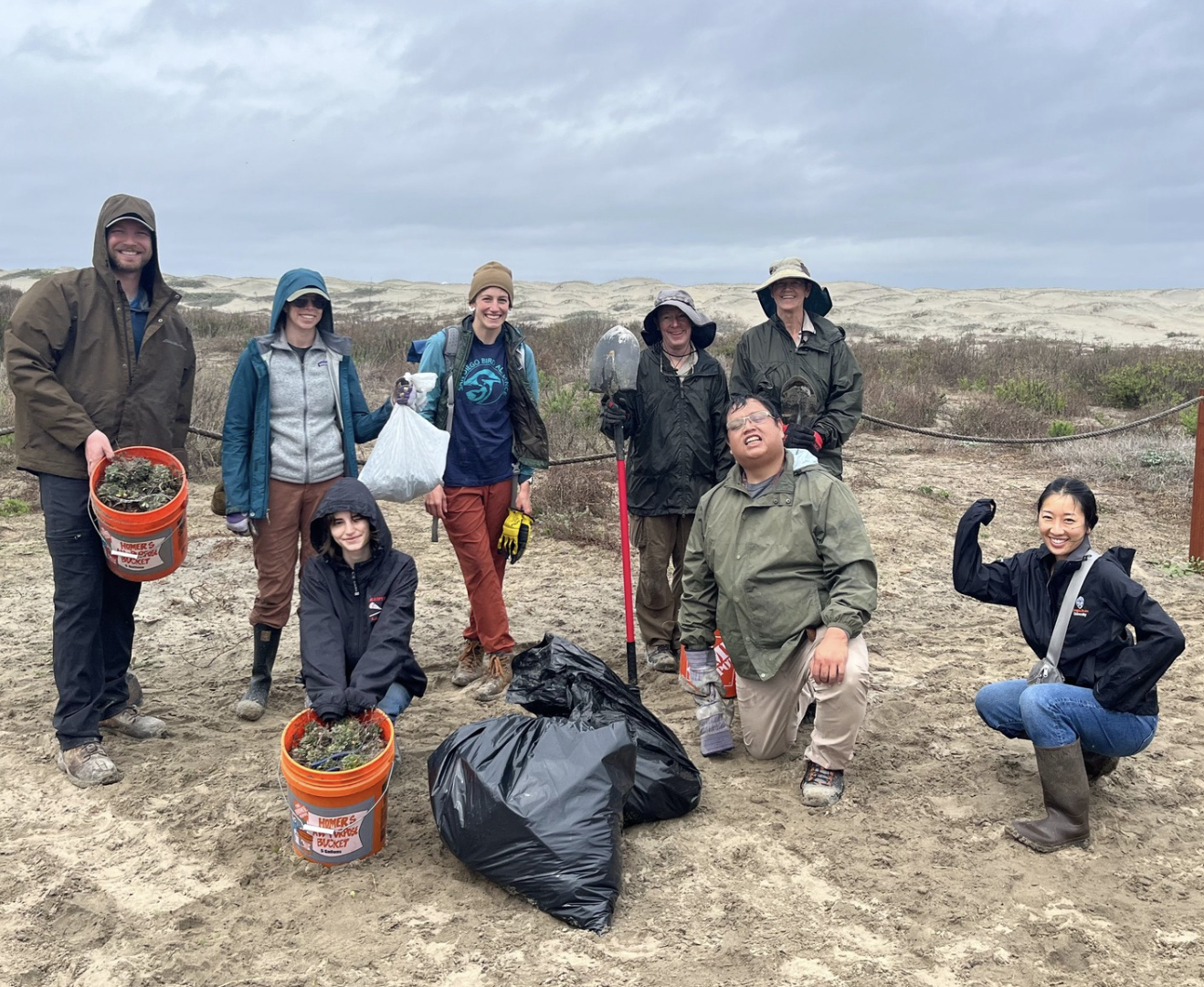 Habitat Restoration At The San Diego River Estuary A group of volunteers show off their hard work at a habitat restoration event at the San Diego River Estuary.