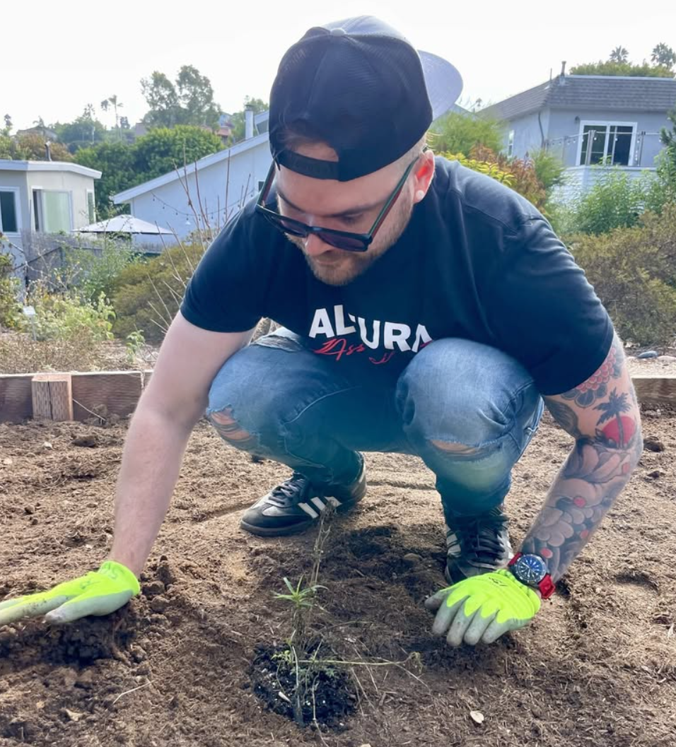 Planting Narrowleaf Milkweed At The Point Loma Native Plant Garden A man plants Narrowleaf Milkweed at the Point Loma Native Plant Garden
