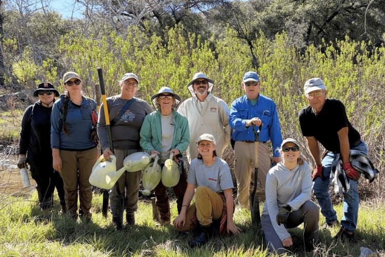 photo of group of volunteers up at the preserves with shovels and watercans in their hands