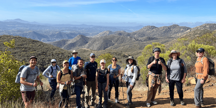 group of hikers with the river gorge in the background