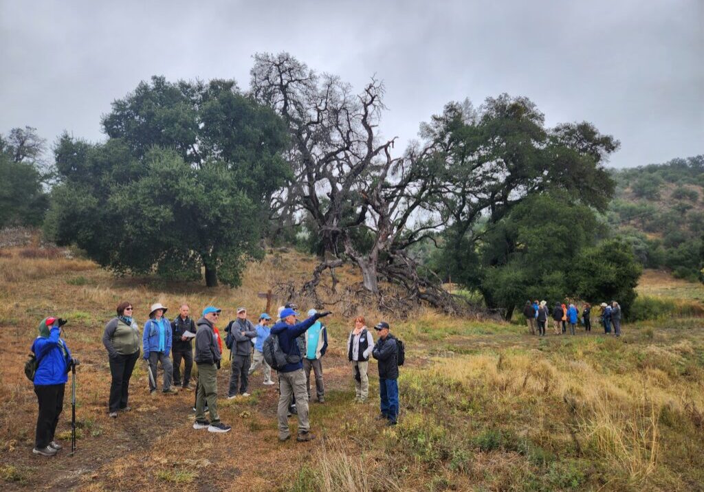 Eagle Peak Ranch group hike A group of hikers receive direction on the trail in Eagle Peak Ranch